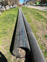 Pre-insulated pipe laying. Water supply pipe and sewer pipe on construction site will be laid...