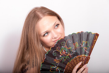 girl with a fan closeup