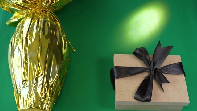 Easter egg with a gift. Multicolored Easter eggs wrapped in foil.