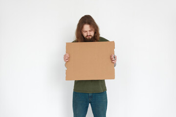 Ukrainian man refugee holding cardboard on white background