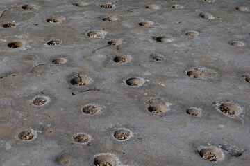 Indian grinding stones carved into a flat rock