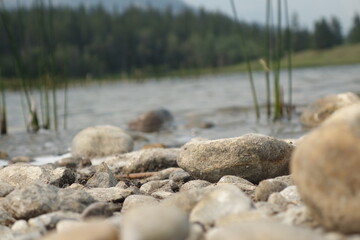 Fototapeta na wymiar Rock bed on mountain lake 