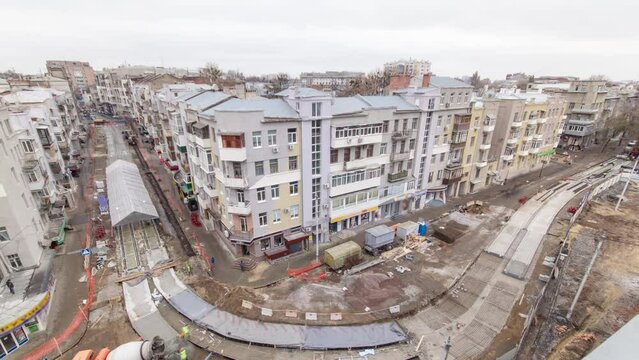 Concrete works for road maintenance construction site with many workers and mixer timelapse
