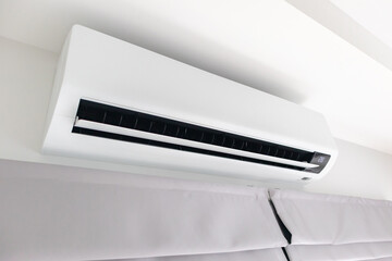 Air conditioner on white wall room interior background