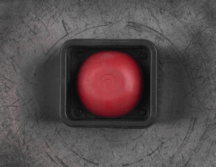 red alarm button on metal background