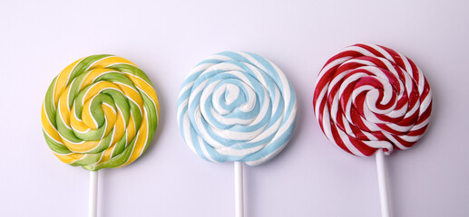 Set of colorful lollipops on white background