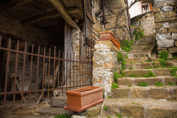 A residential street in Poffabro, an historic medieval village in the Val Colvera valley in...