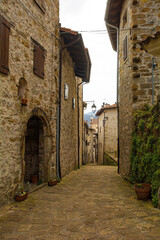 A residential street in Poffabro, an historic medieval village in the Val Colvera valley in Pordenone province, Friuli-Venezia Giulia, north east Italy
