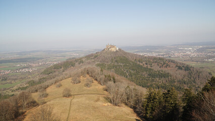 Fototapeta premium Hohenzollern Castle sitting on top of a hill near the Albsteig hiking trail in Baden-Württemberg state of Germany.