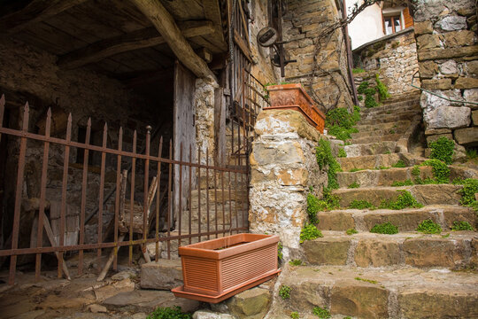 A residential street in Poffabro, an historic medieval village in the Val Colvera valley in Pordenone province, Friuli-Venezia Giulia, north east Italy
