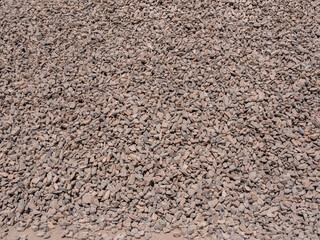 The texture of granite gravel. A large pile of building rubble.