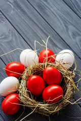 Easter background with dark red Easter eggs. Top view with copy space	
