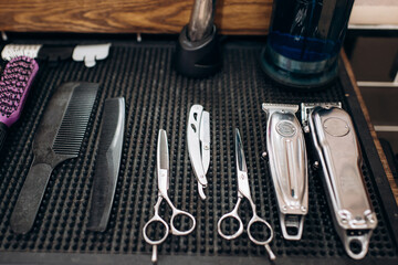 a set of professional barber's tools and scissors