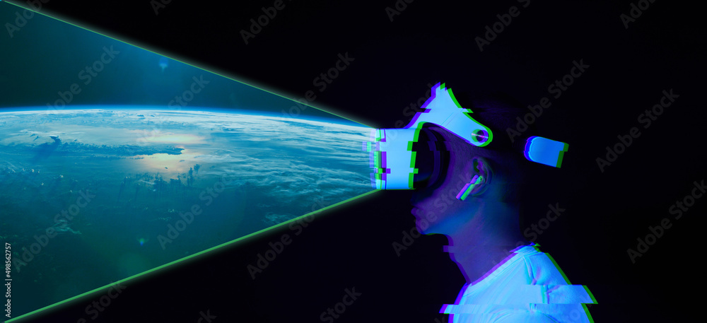 Wall mural man uses virtual reality headset to see the far corners of space. elements of this image furnished b