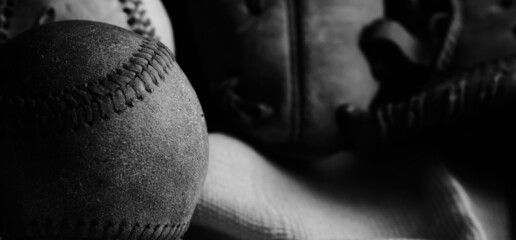 Old used baseball ball with dark grunge texture for sport nostalgia feel.