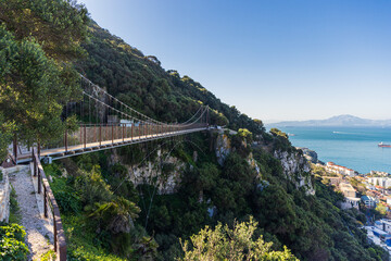 A panorama view along the side of the Windsor Suspension bridge above the town of Gibraltar on a spring day