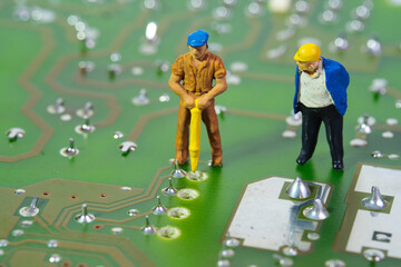 a team of technicians working on an electronic circuit board