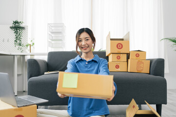 Starting small businesses SME owners female entrepreneurs Write the address on receipt box and check online orders to prepare to pack the boxes, sell to customers, sme business ideas online.