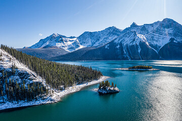 Beautiful winter landscape with the lake and mountains. Canadian nature.