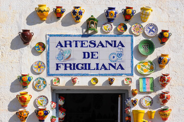 Colorful, ceramic pots and dishes exposed for sale in Frigiliana, Spain