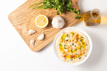 Delicious hummus with chickpeas, olive oil, lemon and pita bread. Vegetarian food concept.