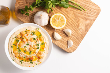 Delicious hummus with chickpeas, olive oil, lemon and pita bread. Vegetarian food concept.