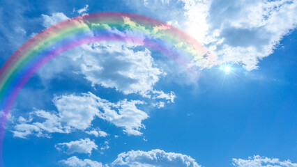 Bright blue sky with rainbow and sunshine_wide_66