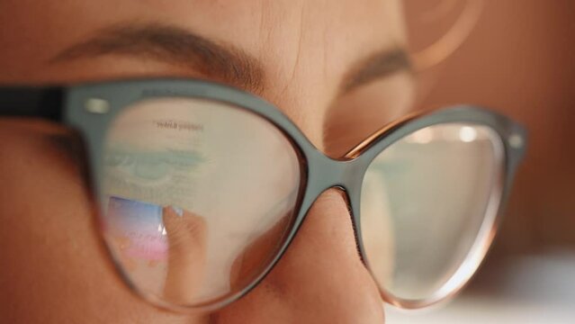 Reflection in glasses of the hands and credit card making e bank online payment. Ecommerce website payments concept.