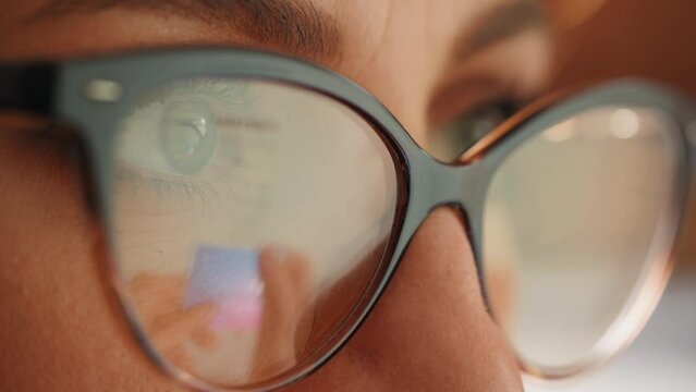 Female hands of cardholder holding credit card making e bank online payment. Woman consumer paying for purchase in web store using laptop technology. Ecommerce website payments concept. Close up view
