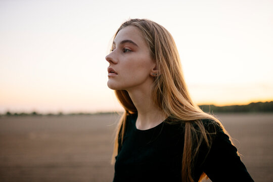 Portrait of a young woman with long blond hair