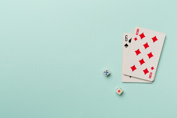 Playing cards and dices on color background. Gambling concept. Top view