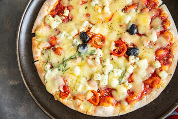 pizza cheese, tomato sauce, olives, vegetables fresh healthy meal food snack diet on the table copy space food background rustic top view keto or paleo diet veggie vegan or vegetarian food no meat