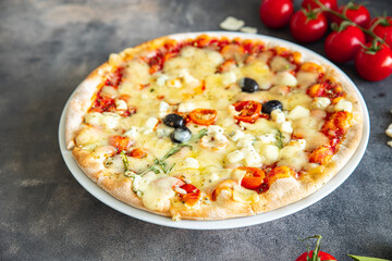 pizza cheese, tomato sauce, olives, vegetables fresh healthy meal food snack diet on the table copy space food background rustic top view keto or paleo diet veggie vegan or vegetarian food no meat