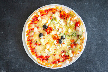 pizza cheese, tomato sauce, olives, vegetables fresh healthy meal food snack diet on the table copy space food background rustic top view keto or paleo diet veggie vegan or vegetarian food no meat