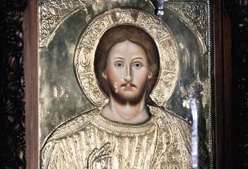 Icon of Jesus Christ handcrafted and covered with gold inside a Christian orthodox church in...