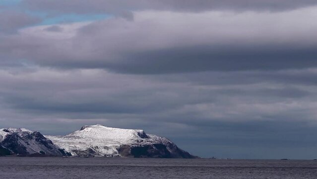 the Norwegian coast at Ulsteinvik- Time lapse clouds over Runde