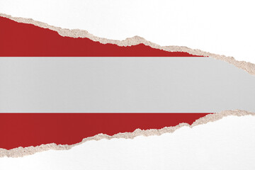 Ripped paper background in colors of national flag. Austria