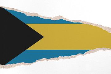 Ripped paper background in colors of national flag. Bahamas