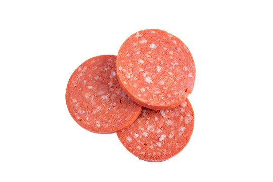 Sliced sucuk or sausage isolated on white background, top view