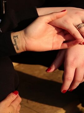 Lesbian couple holding hands.