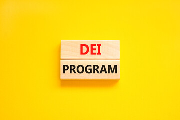 DEI diversity equity inclusion program symbol. Blocks with words DEI program on beautiful yellow background. Business DEI diversity equity inclusion program concept. Copy space.