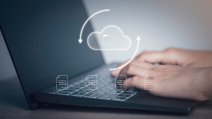 Document Management Data System (DMS) concept. Businessman working with laptop computer with cloud and document icons on virtual screen upload, download.