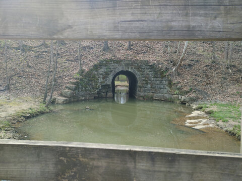 Water flowing out of the pond into the tunnel