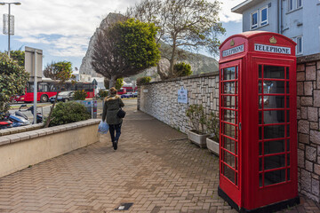 GIBRALTAR, UK - APRIL 7, 2022 - Old vintage red English telephone both at street of Gibraltar.