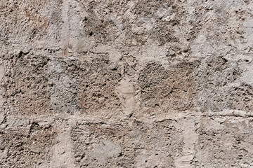 Old gray and beige stone external wall of 18th century Havana Cathedral
