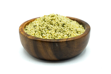 Hemp seeds in wooden bowl isolated on white background