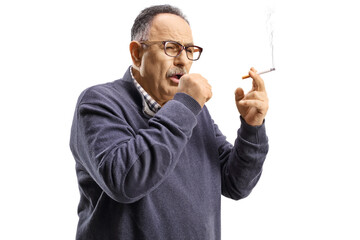 Mature man smoking and coughing
