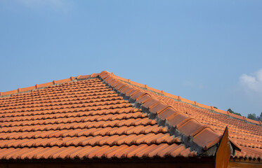 View of roof tiles on guest house. Retro styling of roof with tiles.