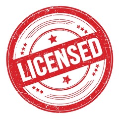 LICENSED text on red round grungy stamp.