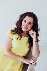 beautiful woman in a yellow summer dress